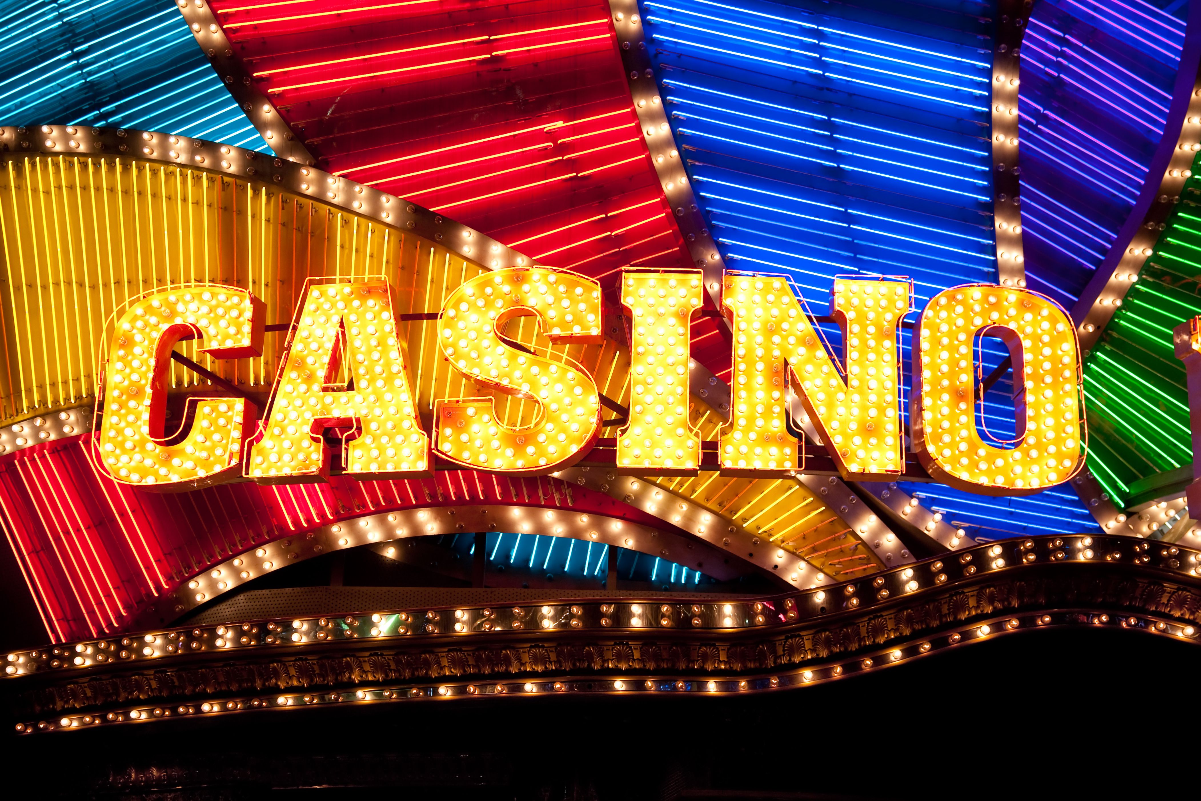 A glamorous graphic showcasing the Hollywood Casino logo with a red carpet and spotlights.